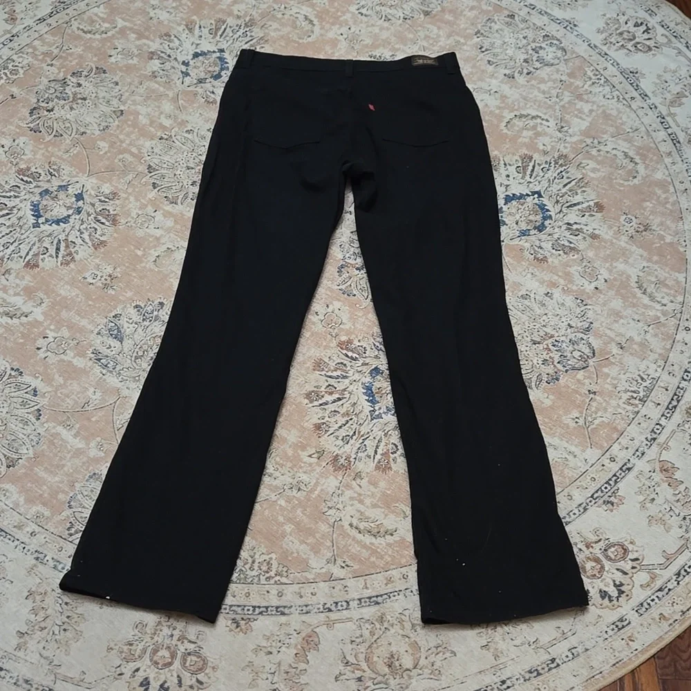 Levi's 550 relaxed boot cut Black jeans classic 5 pocket stretch 12 M Excellent…